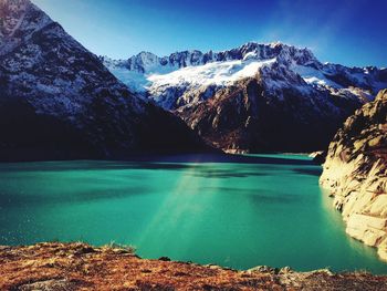 Scenic view of lake against cloudy sky