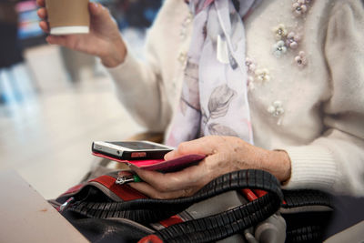 Close-up of man using mobile phone