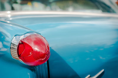 Red tail light on blue classic car