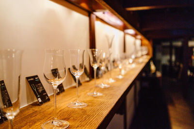 Row of wine glass on table at restaurant