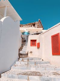 Houses against clear blue sky in city