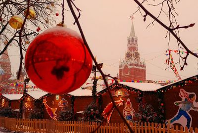 Close-up of illuminated christmas lights against building