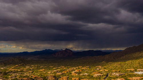 Scenic view of mountains against dramatic sky