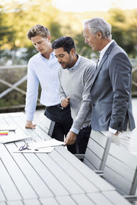 Businessmen working on patio