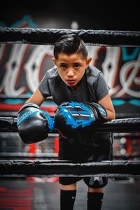 Portrait of boy standing outdoors