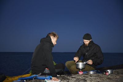View of tourists camping at sea