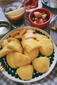 High angle view of fruits in plate on table