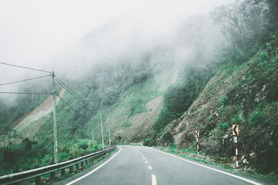 Country road leading towards mountain