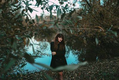 Portrait of young woman in forest