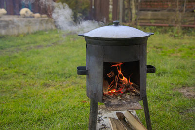 Cooking in a cauldron on the fire. picnic outdoors in summer.