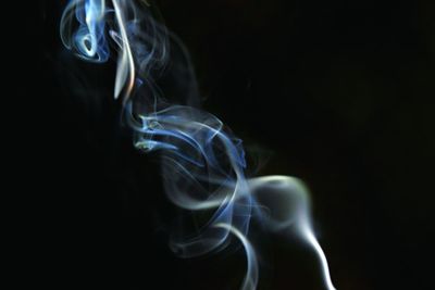 Close-up of smoke against black background