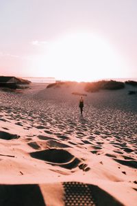 Scenic view of beach against sky during sunset