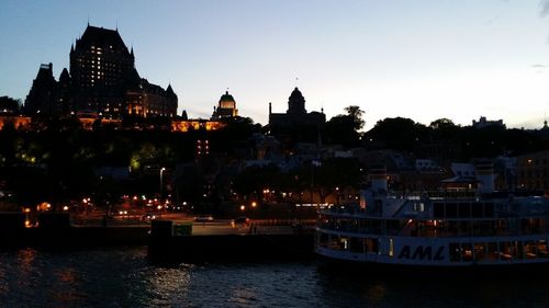 View of illuminated buildings at waterfront