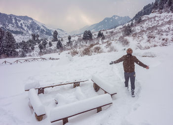 Man standing on snow covered mountain
