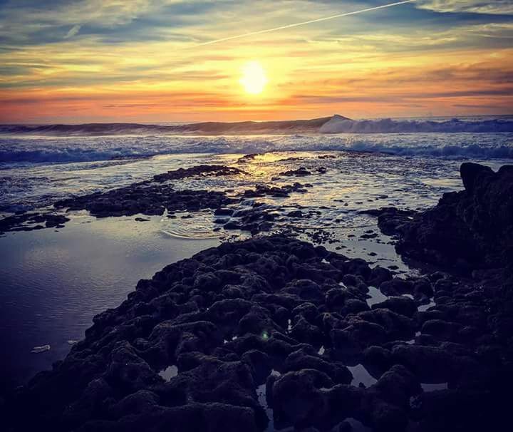 sunset, beach, beauty in nature, sea, reflection, sun, nature, water, outdoors, sky, scenics, cloud - sky, no people, landscape, horizon over water, day