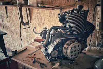 Motorcycle engine on table in room