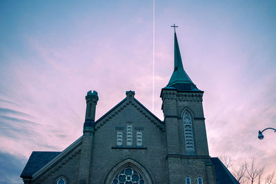 Low angle view of church against sky during sunset