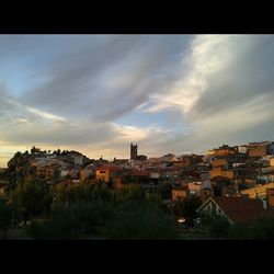 Town against cloudy sky