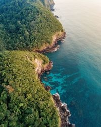 High angle view of rocks by sea