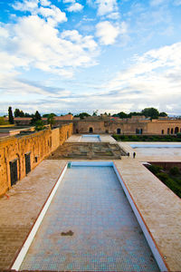 View of swimming pool against buildings in city