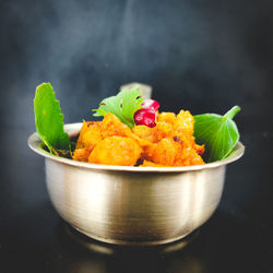 Close-up of orange slices in bowl on table