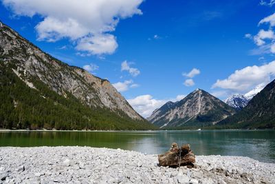 Scenic view of lake and mountains against sky