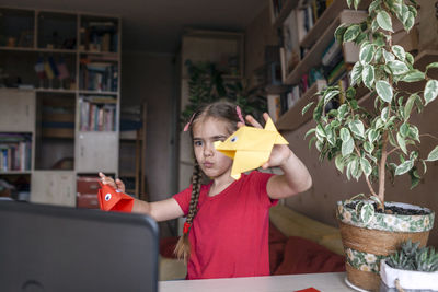 Young woman using mobile phone at home