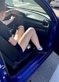 Woman sitting in car