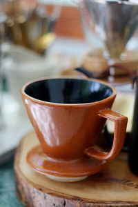 Close-up of coffee cup on table