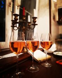 Close-up of wine glasses on table in restaurant