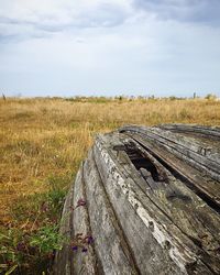 Railroad track amidst field against sky