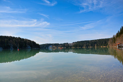 Scenic view of lake against blue sky