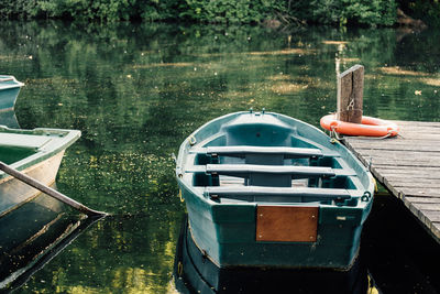 Boats moored on lake