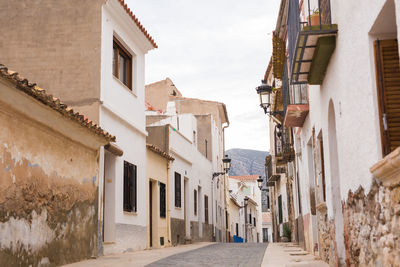 Narrow street amidst buildings in town