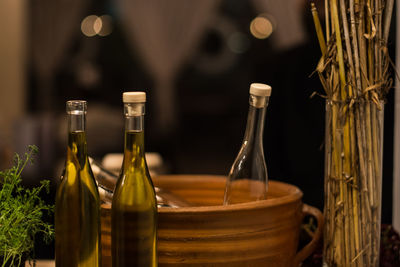 Close-up of wine bottles in glass