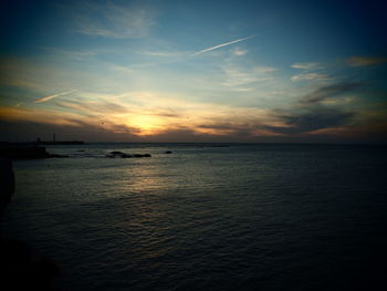 Scenic view of sea against sky at sunset