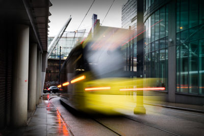 Blurred motion of vehicles on road in city