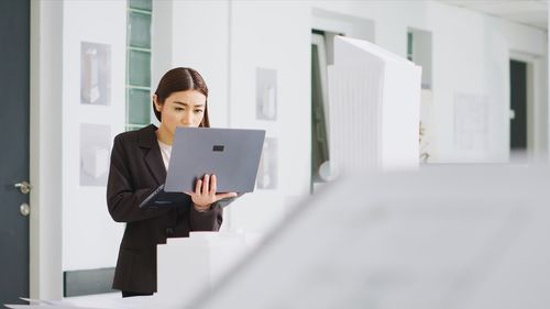 Businesswoman using digital tablet in office