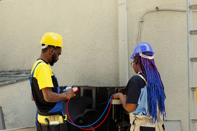 High angle view of construction workers working on street