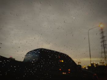 Close-up of wet glass window in rainy season