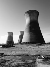 Low angle view of smoke stack against sky