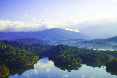 Scenic view of lake and mountains against sky