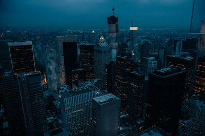 High angle view of illuminated buildings in city against sky