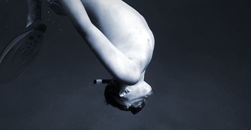 Close-up of woman in mid-air