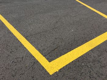 High angle view of arrow sign on road