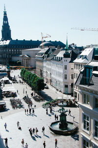 People in city against clear sky