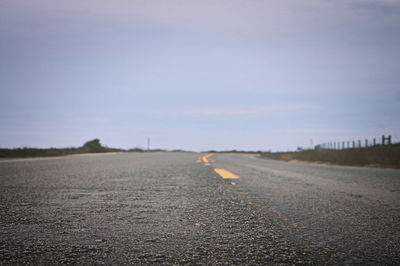 Road on field against sky