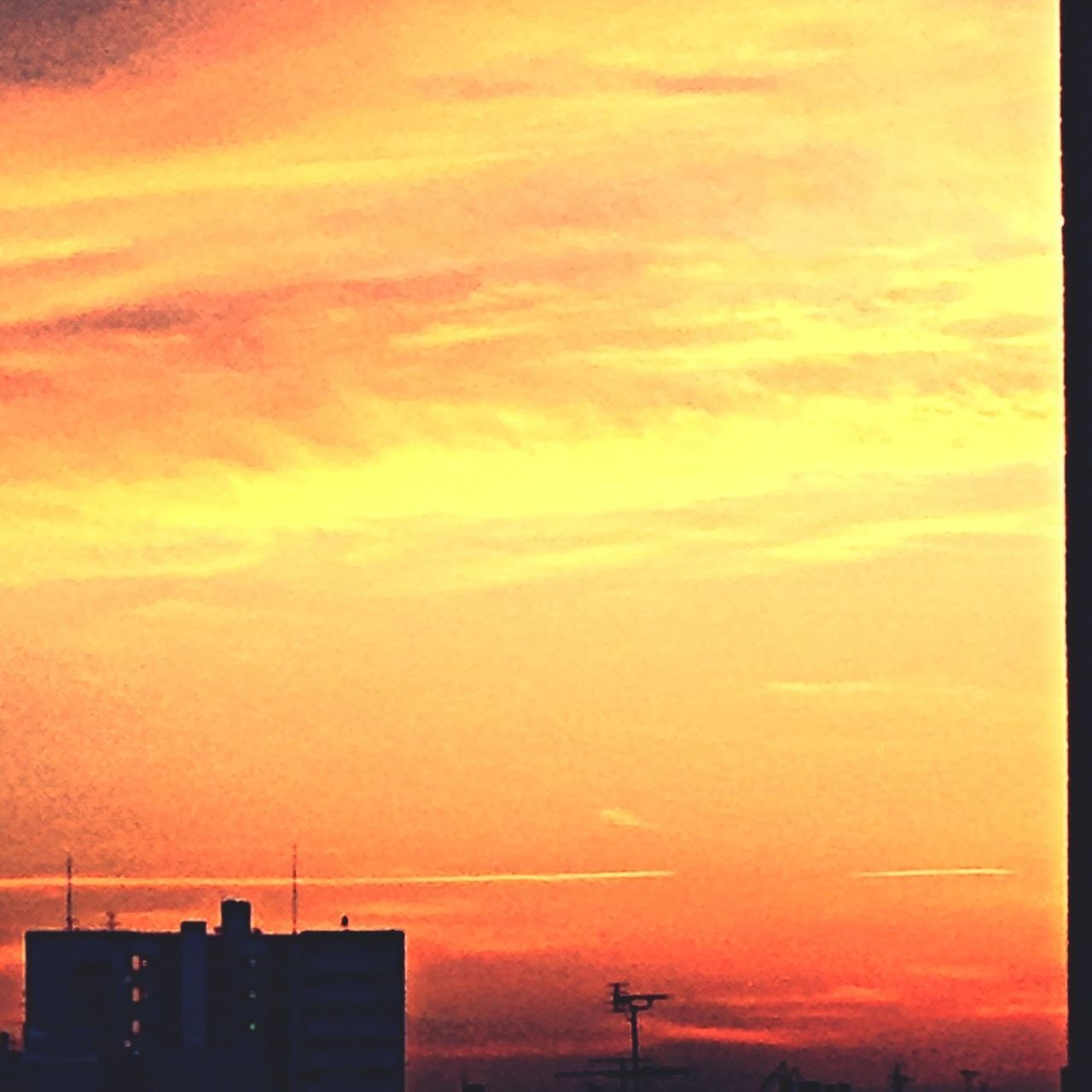 sunset, silhouette, orange color, sky, building exterior, built structure, architecture, low angle view, cloud - sky, beauty in nature, dramatic sky, scenics, nature, outdoors, high section, city, no people, building, cloud, dusk