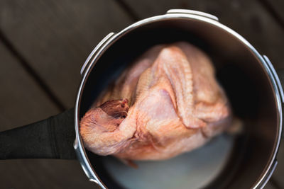 High angle view of meat in container on table