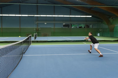 Man playing tennis